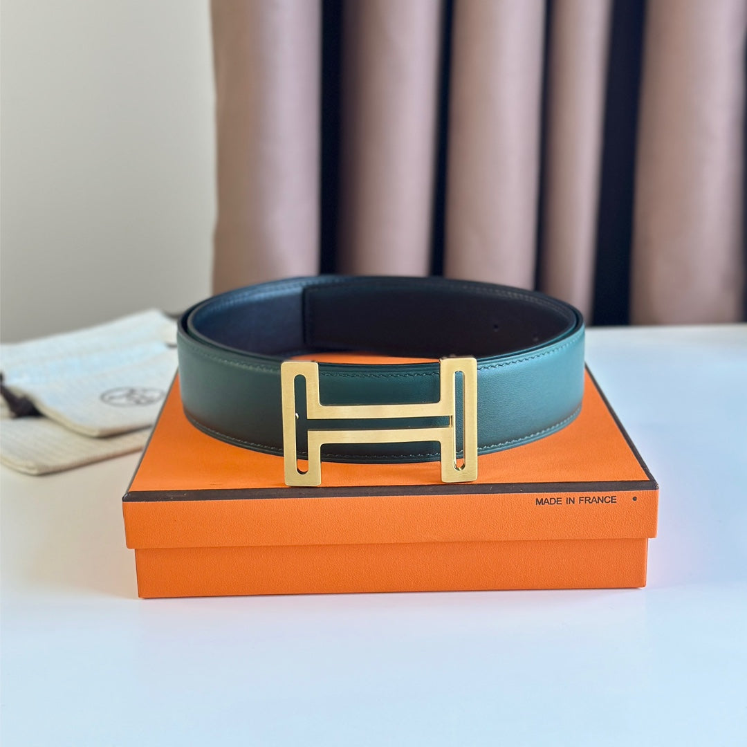 HM  BELT BUCKLE & REVERSIBLE TEAL GREEN AND BLACK LEATHER STRAP 38MM GOLD HARDWARE