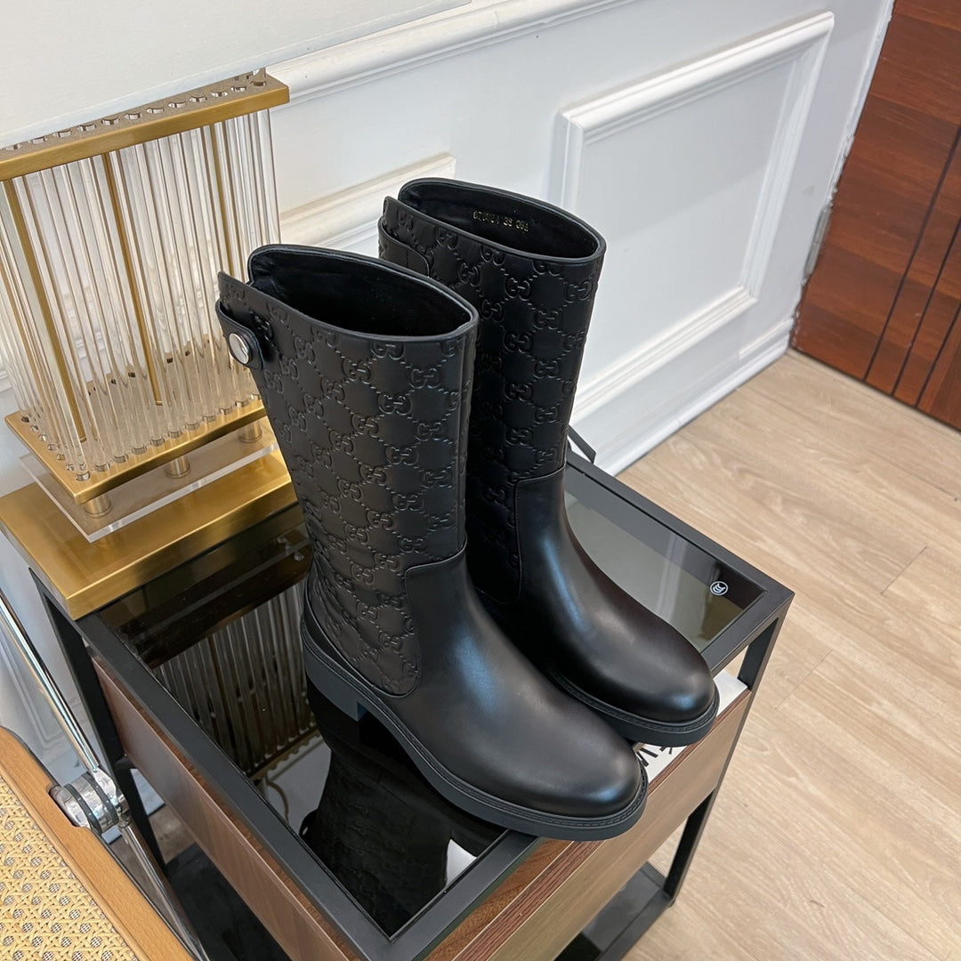 GG EMBOSSED LEATHER ANKLE BOOTS IN BLACK CALFSKIN