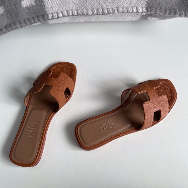 HERM Oran Slide Sandals In Gold Clemence Leather