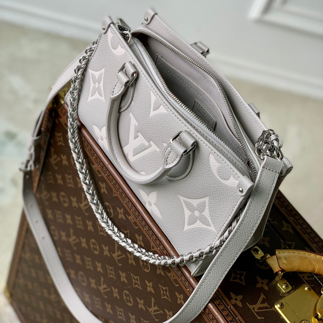 ONTHEGO EAST WEST BAG 25 IN BICOLOR MONOGRAM EMPREINTE LEATHER