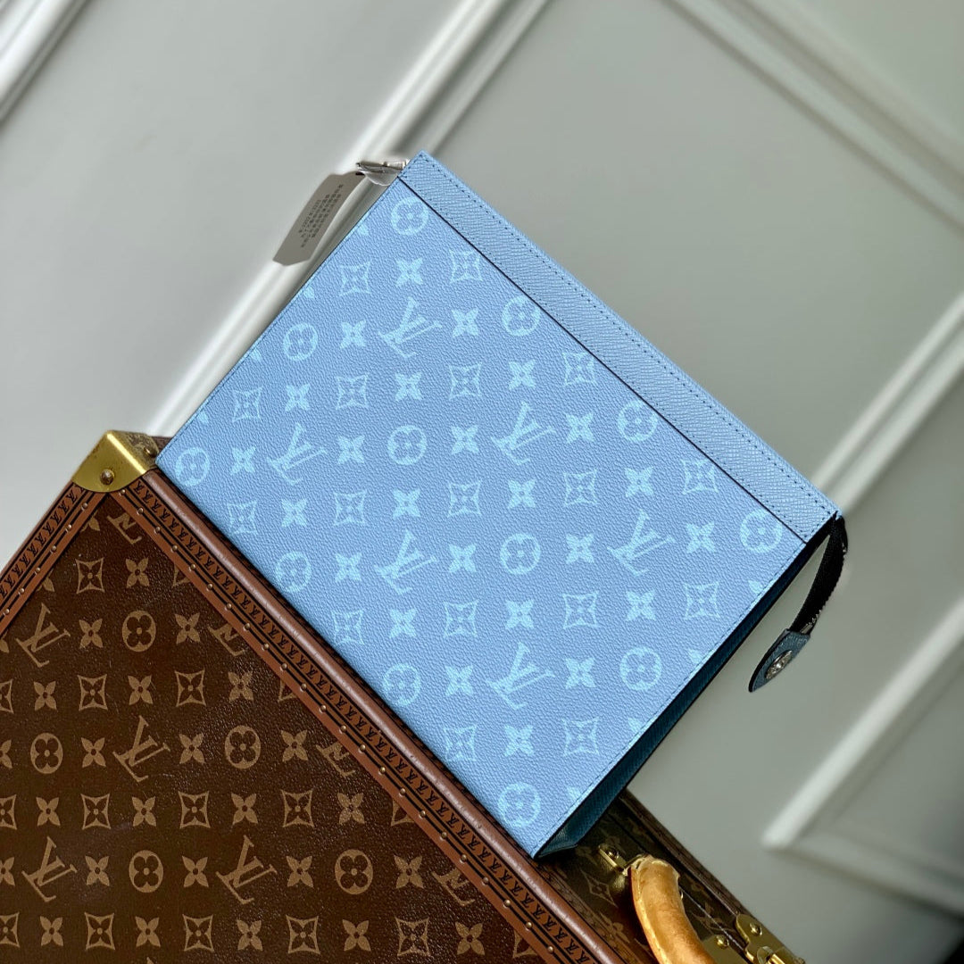 POCHETTE VOYAGE 26 IN LIGHT BLUE MONOGRAM ECLIPSE CALFSKIN