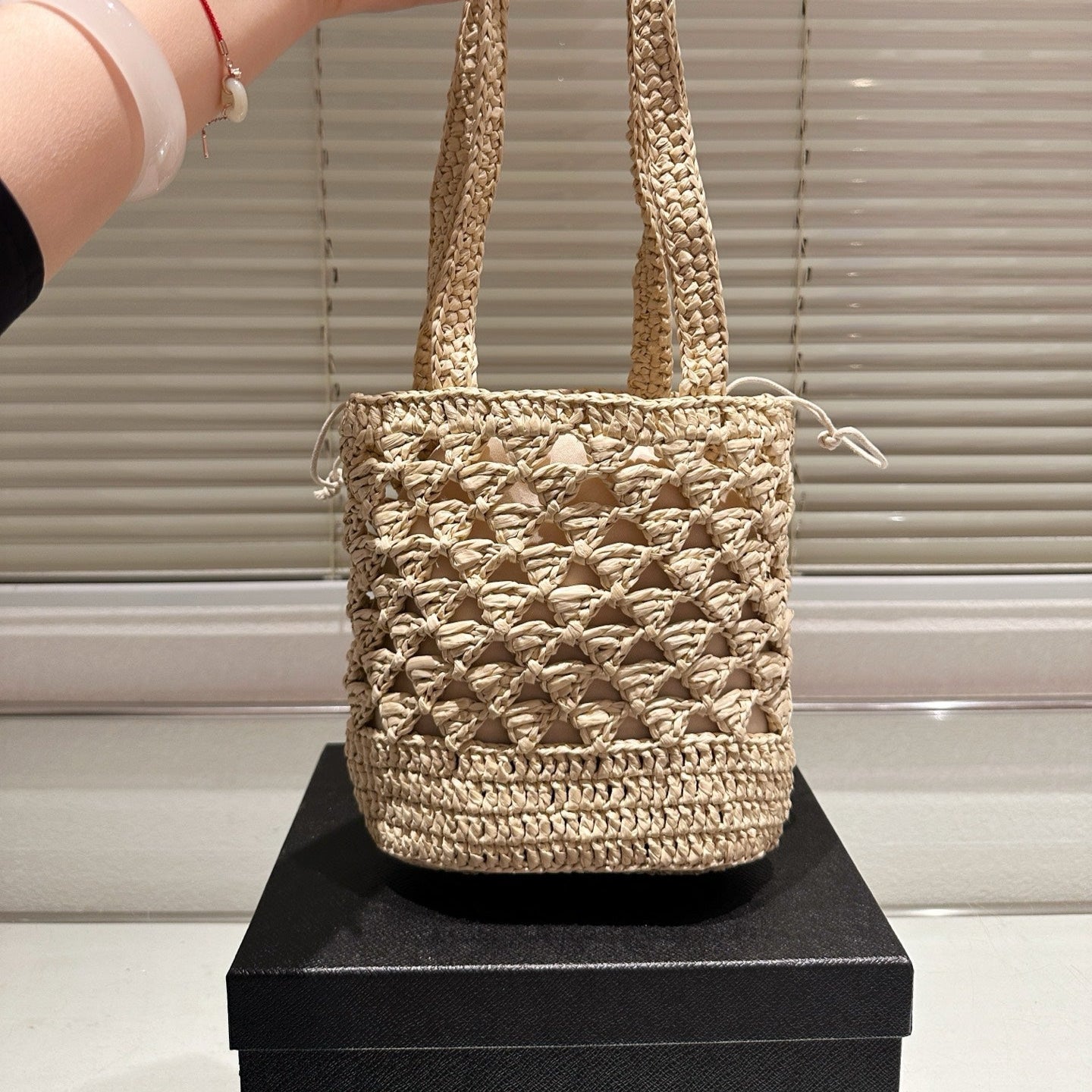 CROCHET BUCKET BAG 18 IN BEIGE WOVEN RAFFIA EMBROIDED LOGO