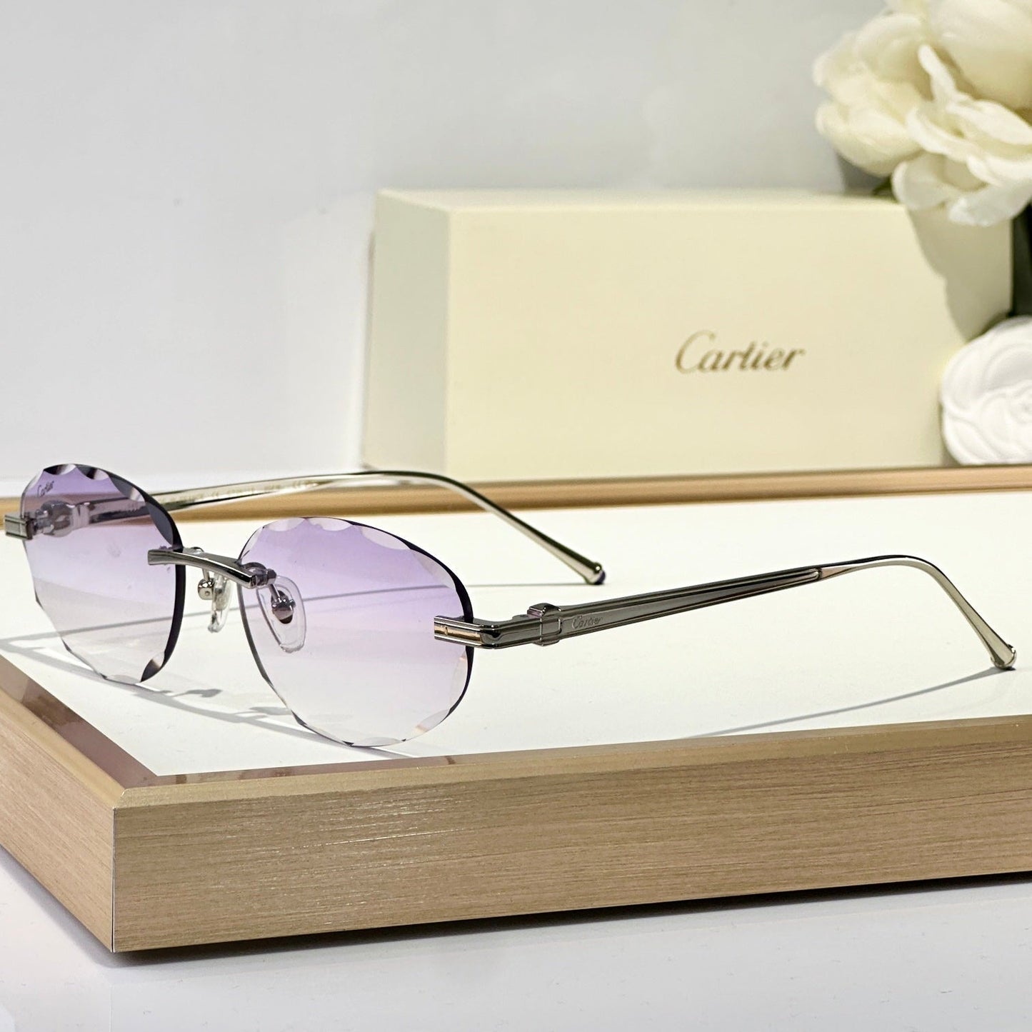 C DE RIMLESS ROUND FRAME SUNGLASSES CT0611S IN METAL