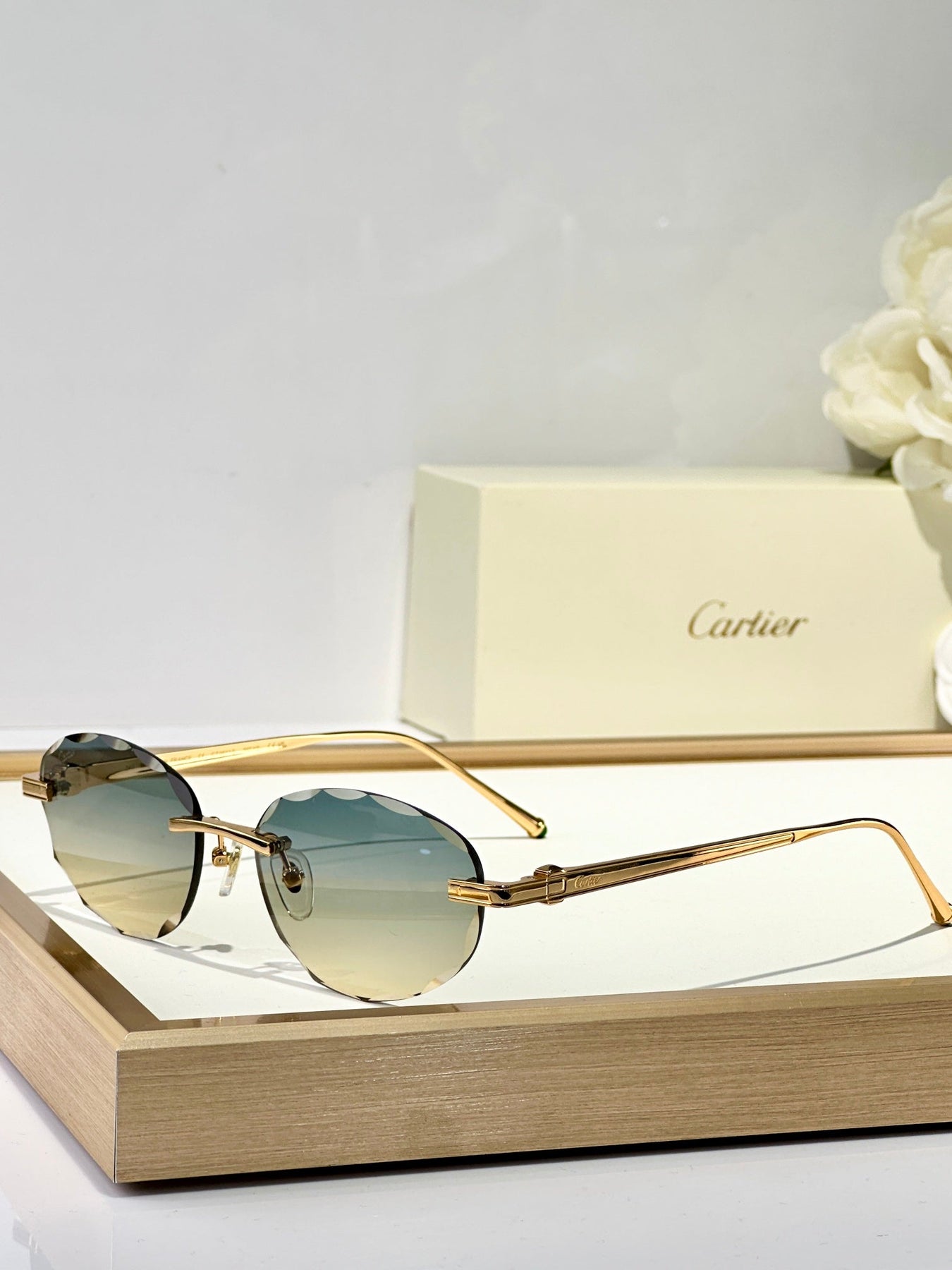 C DE RIMLESS ROUND FRAME SUNGLASSES CT0611S IN METAL
