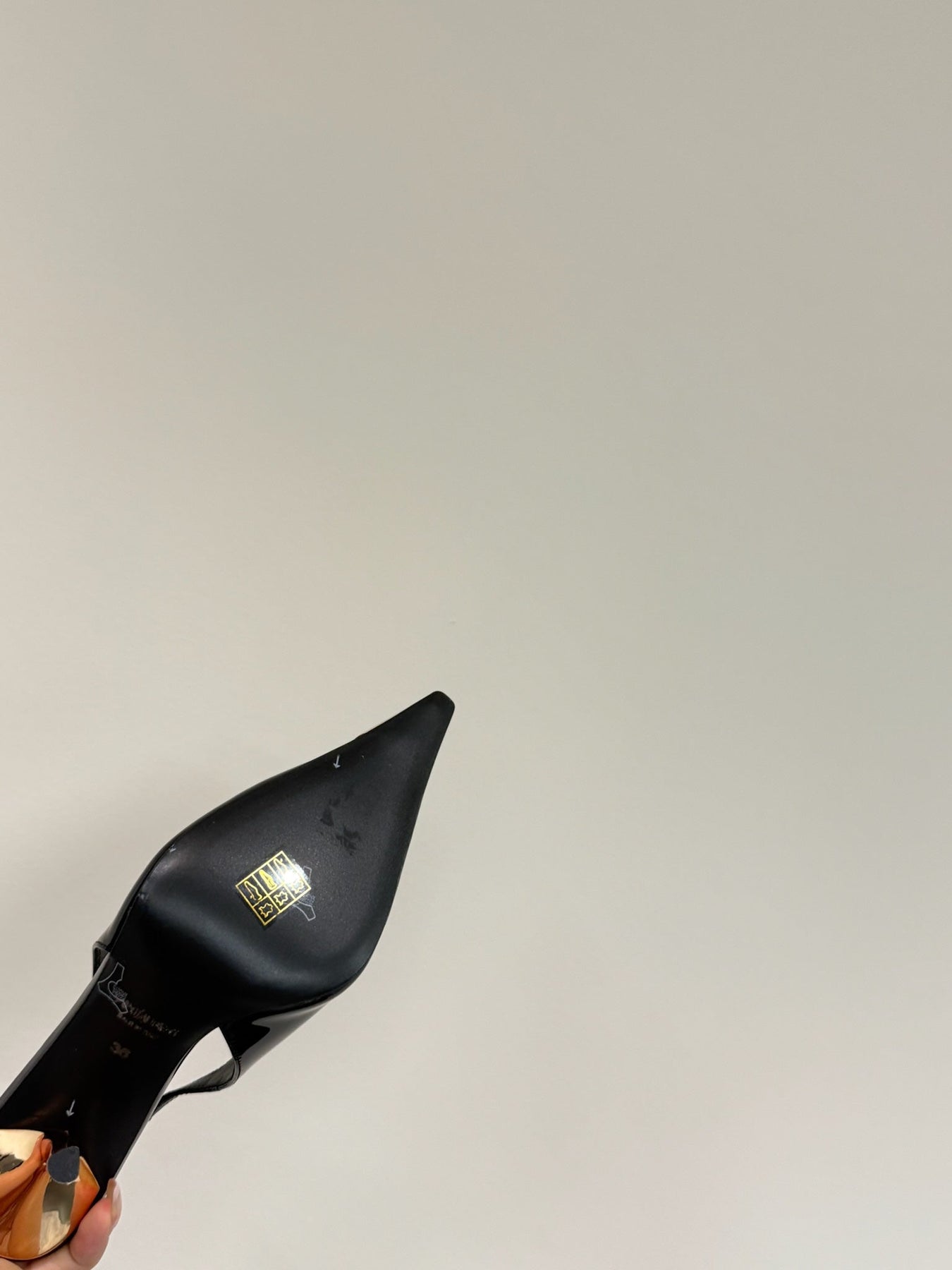 GREEN GEM-STUDDED SLINGBACK PUMPS IN BLACK PATENT CALFSKIN