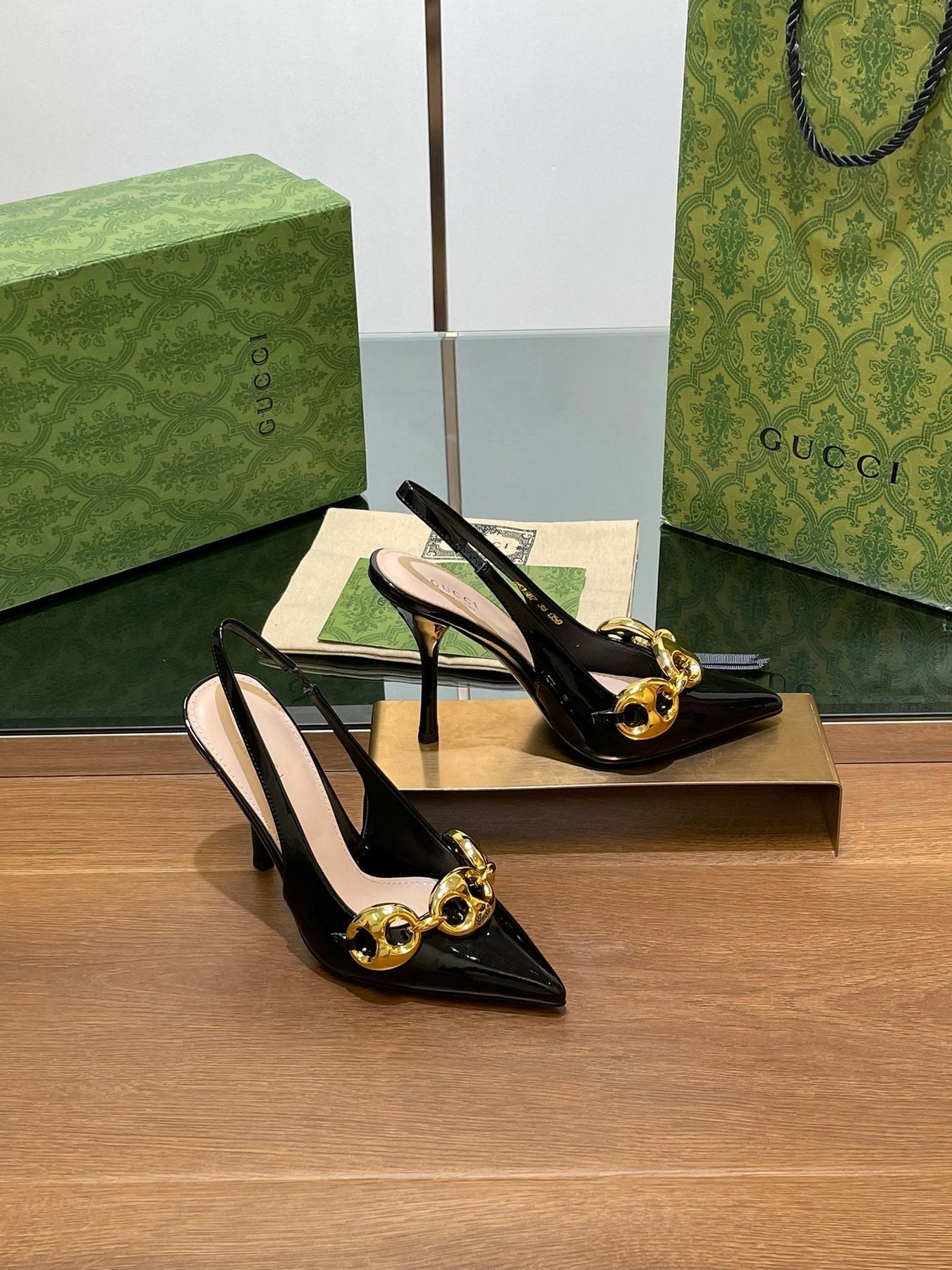 GG HIGH SLINGBACK 10.5 CM IN BLACK GLOSSY CALFSKIN WITH GOLD HARDWARE