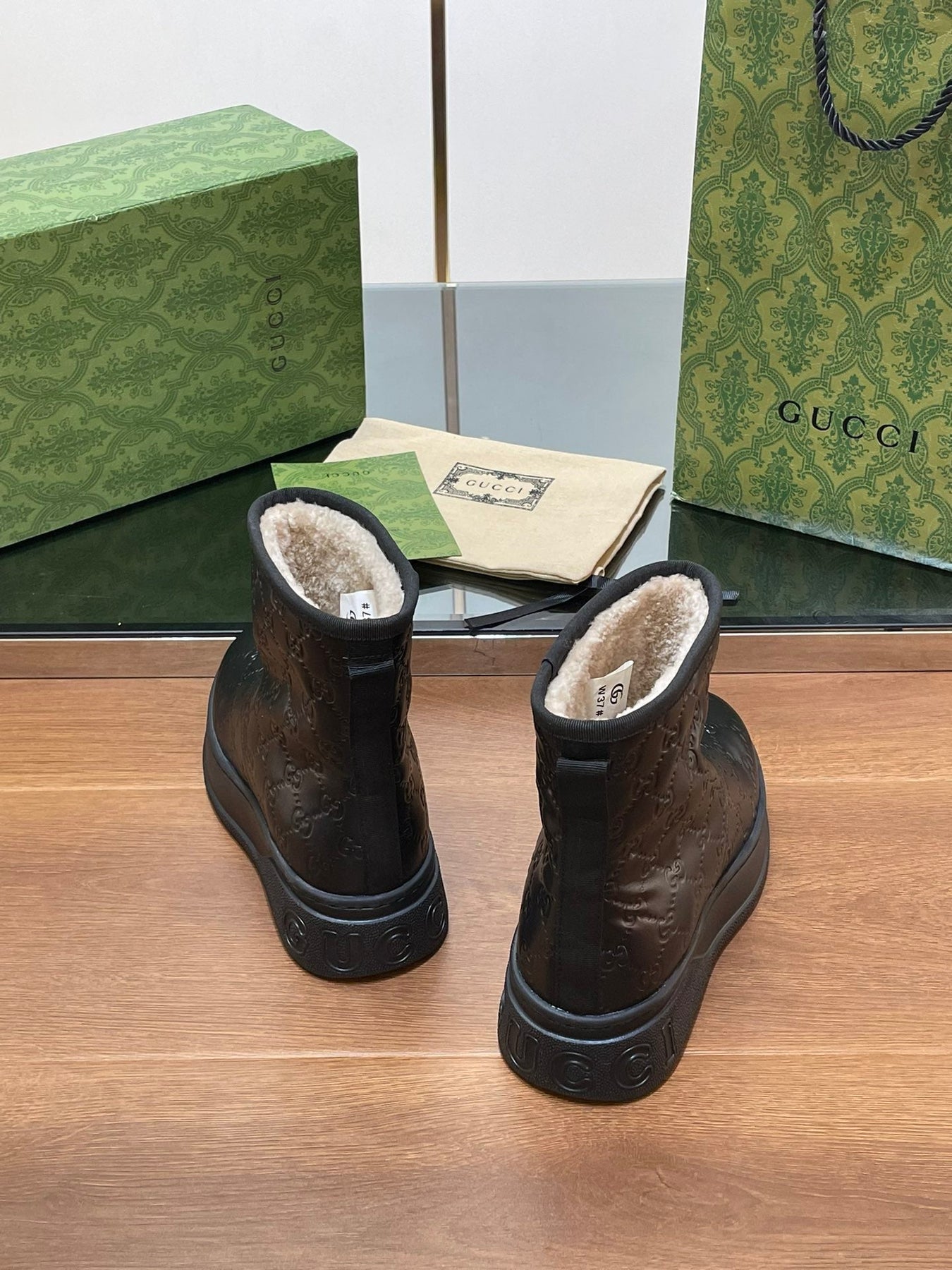 GG UGG BOOTS IN BLACK EMBOSSED SUEDE AND BEIGE WOOL LINING