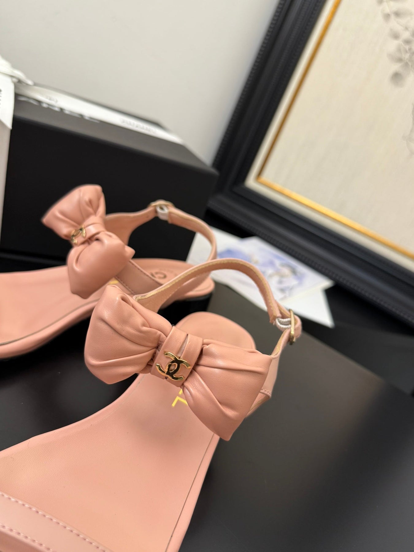 FLAT SANDALS IN PEACHY PINK CALFSKIN WITH BOW