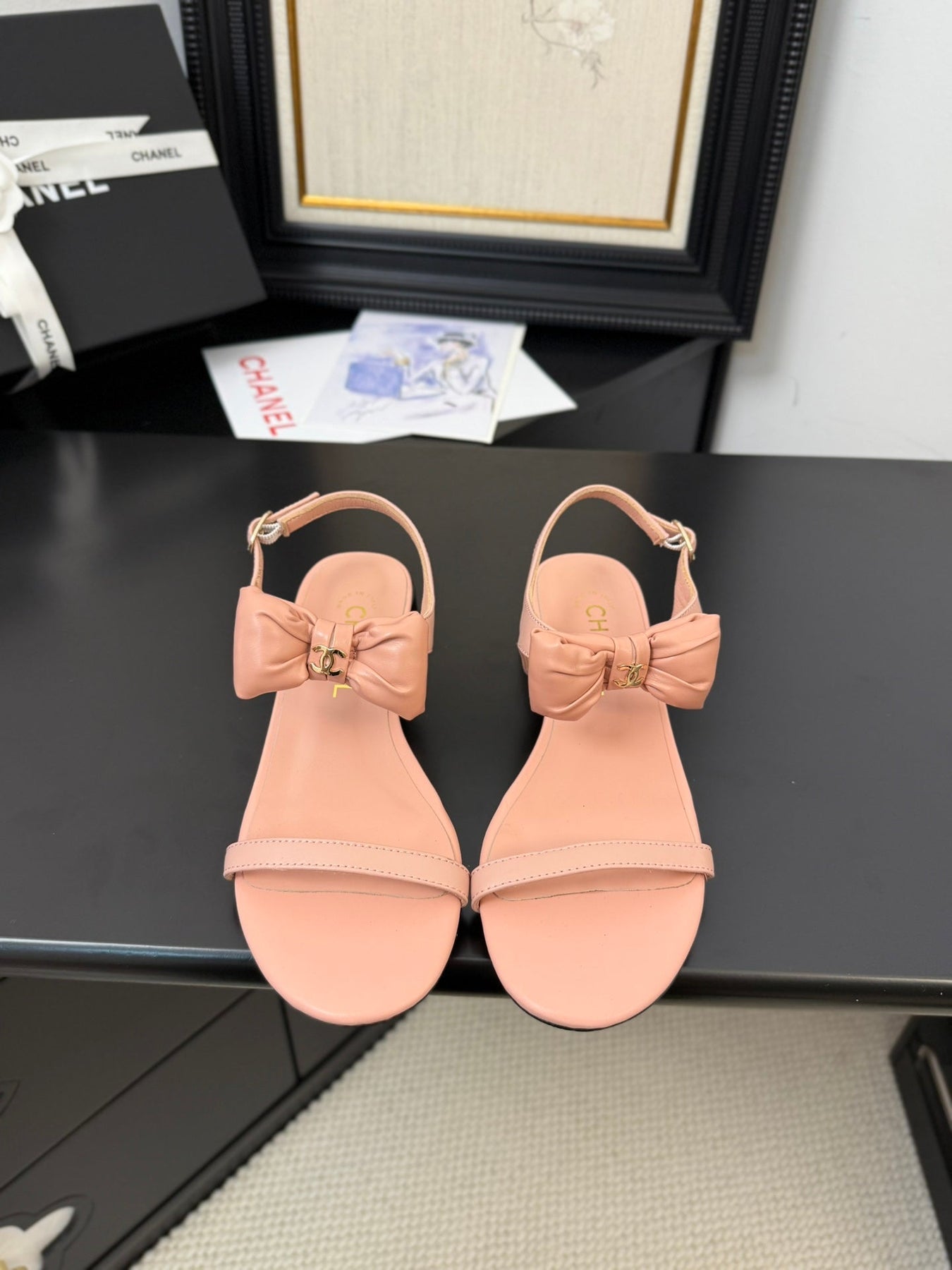 FLAT SANDALS IN PEACHY PINK CALFSKIN WITH BOW