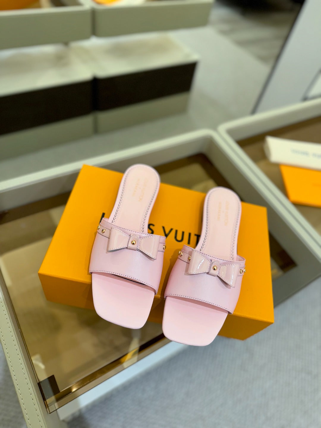 LV X TM 6AM FLAT MULE IN BABY PINK CALFSKIN