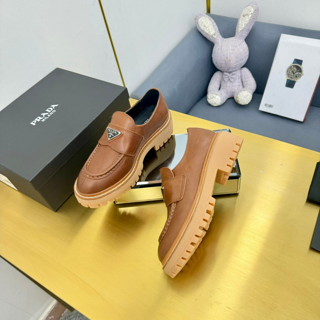 LOAFER WITH TRIANGLE LOGO IN COGNAC CALFSKIN