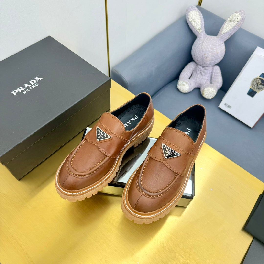 LOAFER WITH TRIANGLE LOGO IN COGNAC CALFSKIN