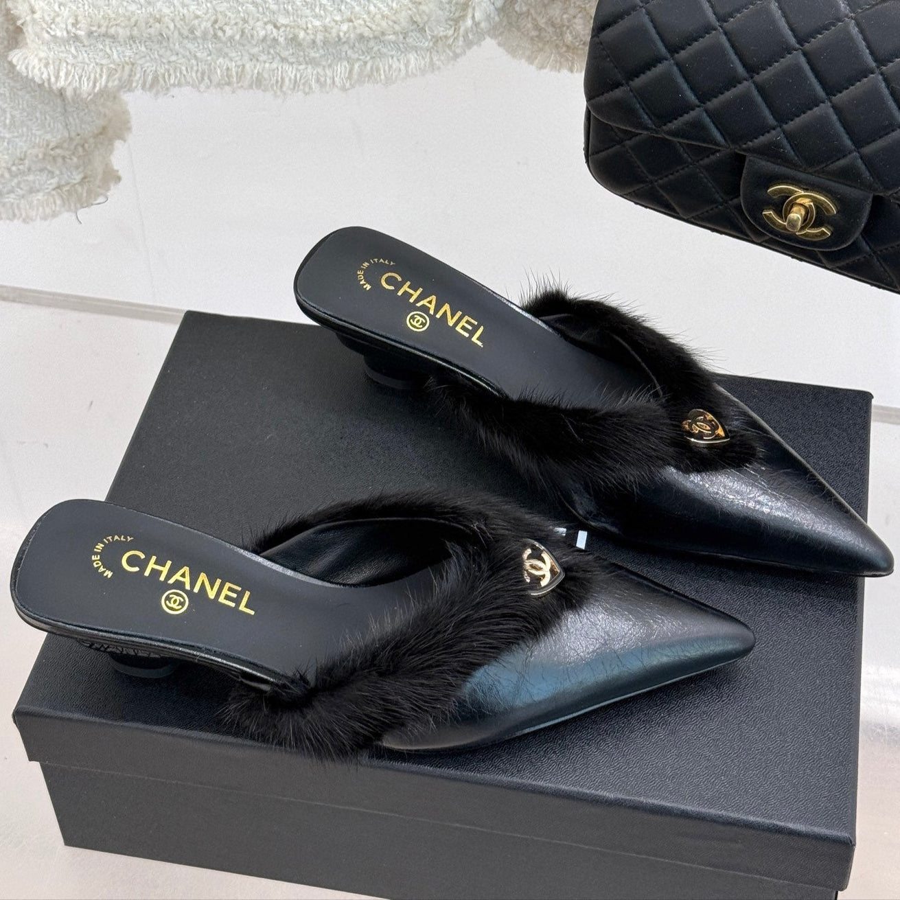 RABBIT FUR POINTED-TOE MULE IN BLACK LAMBSKIN