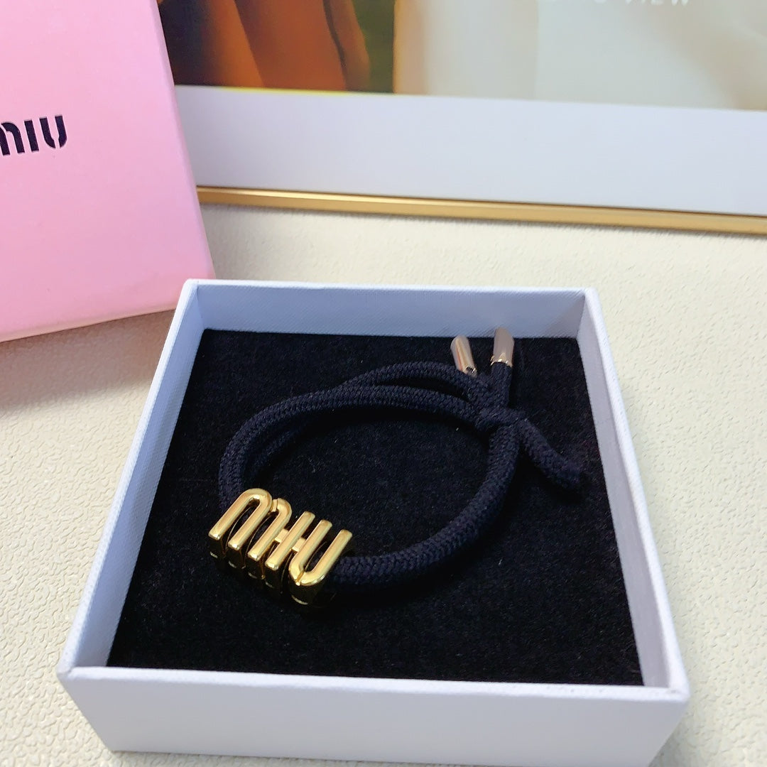 BLACK SCRUNCHIE SPANDEX FABRIC GOLD LOGO 167002