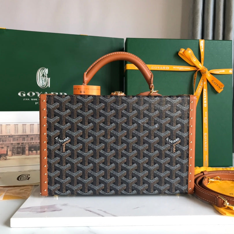 GRAND HÔTEL TRUNK BAG 24 IN BLACK GOYARDINE CANVAS AND TAN CALFSKIN