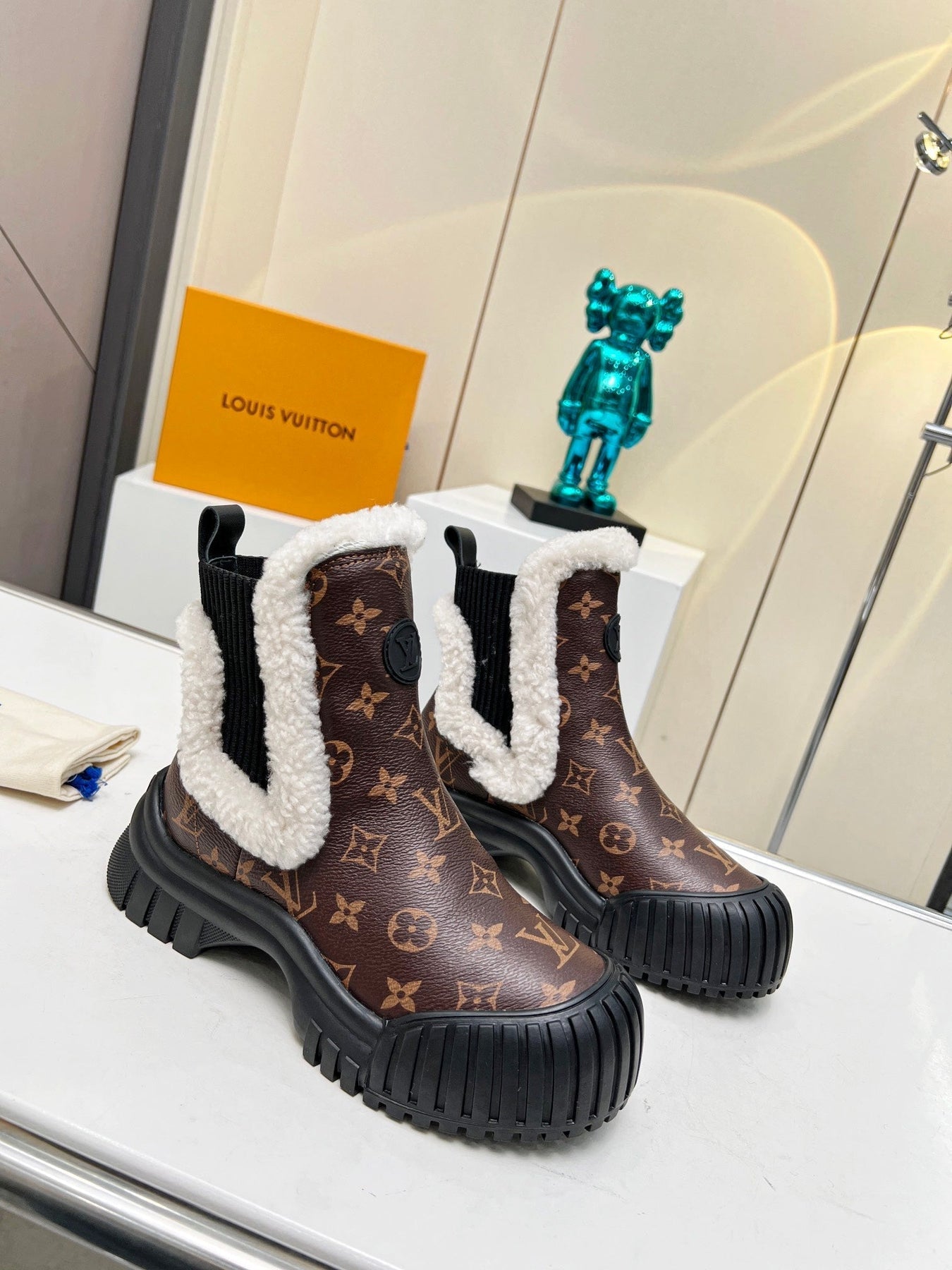 LV RUBY FLAT ANKLE BOOT IN CHOCOLATE BROWN MONOGRAM CALFSKIN AND WHITE SHEARLING