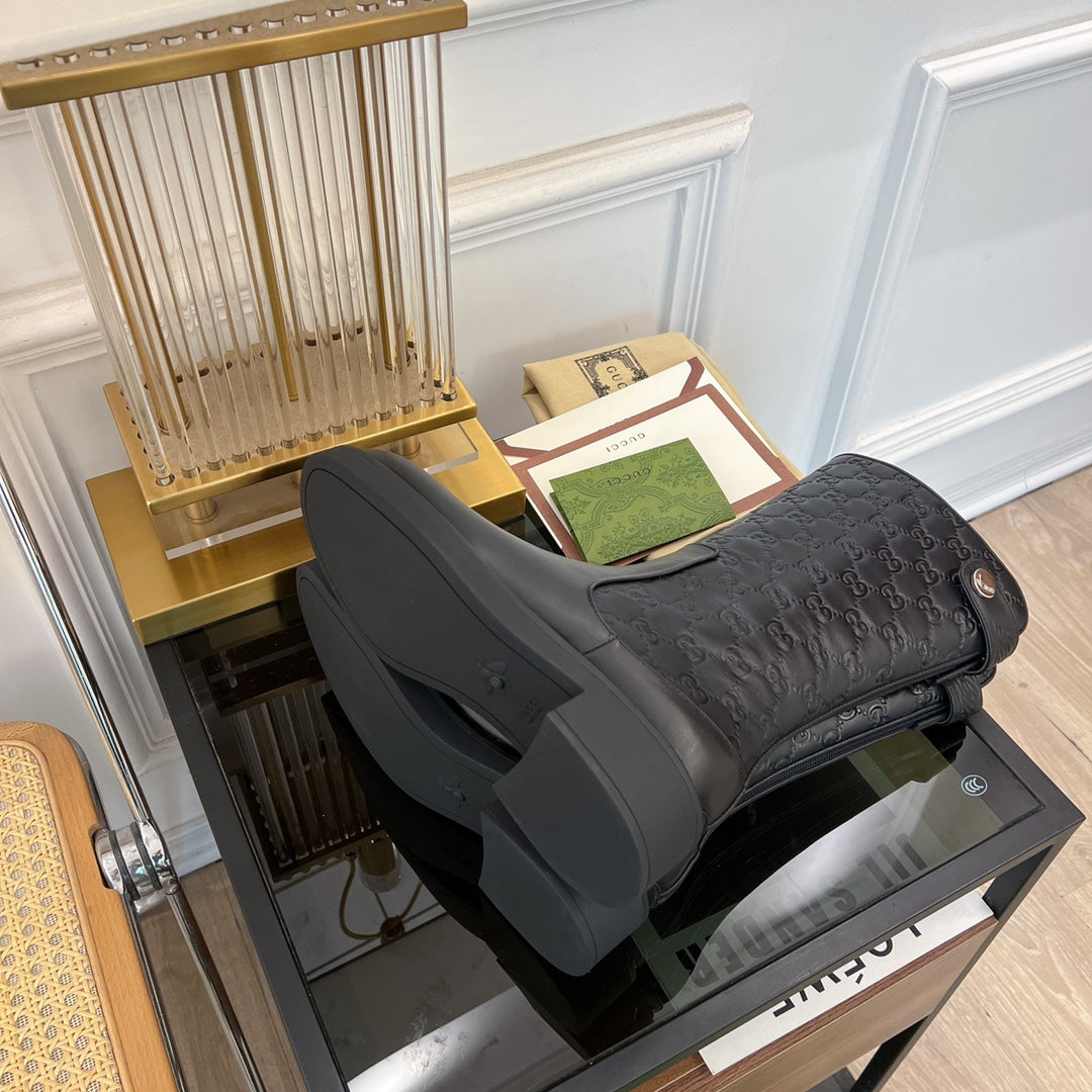 GG EMBOSSED LEATHER ANKLE BOOTS IN BLACK CALFSKIN