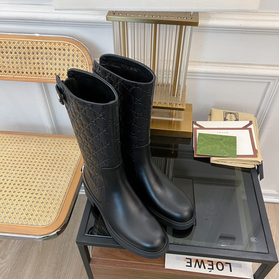 GG EMBOSSED LEATHER ANKLE BOOTS IN BLACK CALFSKIN