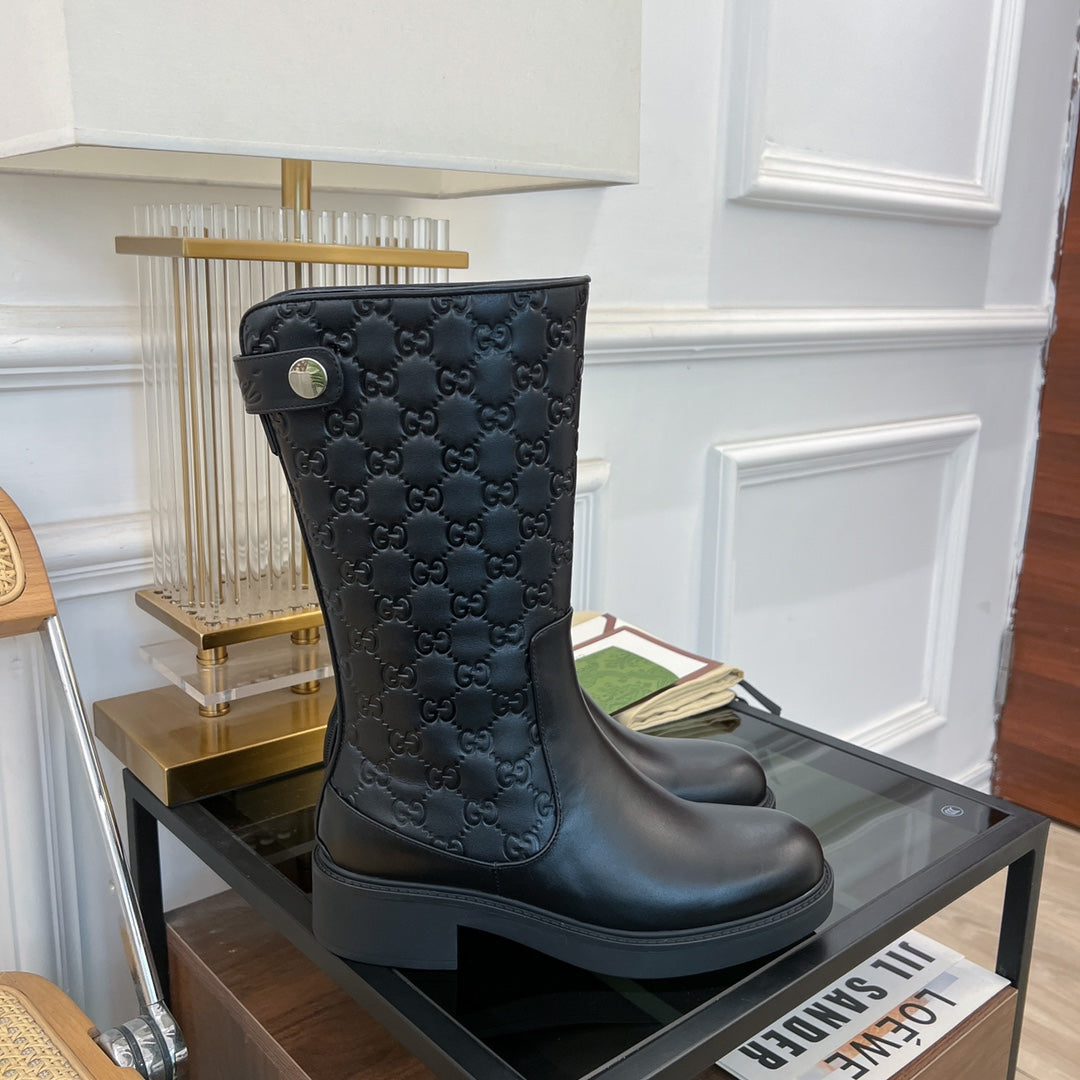 GG EMBOSSED LEATHER ANKLE BOOTS IN BLACK CALFSKIN