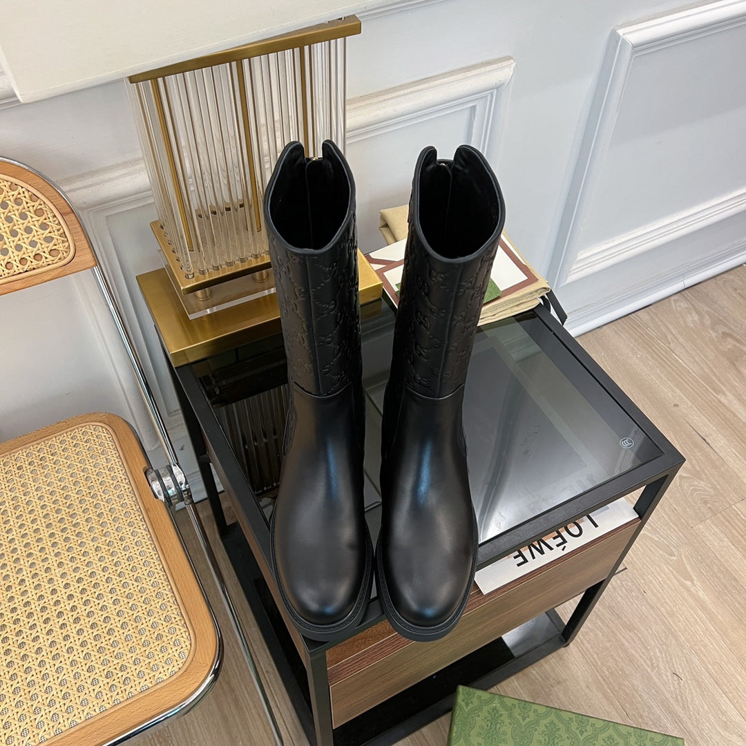 GG EMBOSSED LEATHER ANKLE BOOTS IN BLACK CALFSKIN