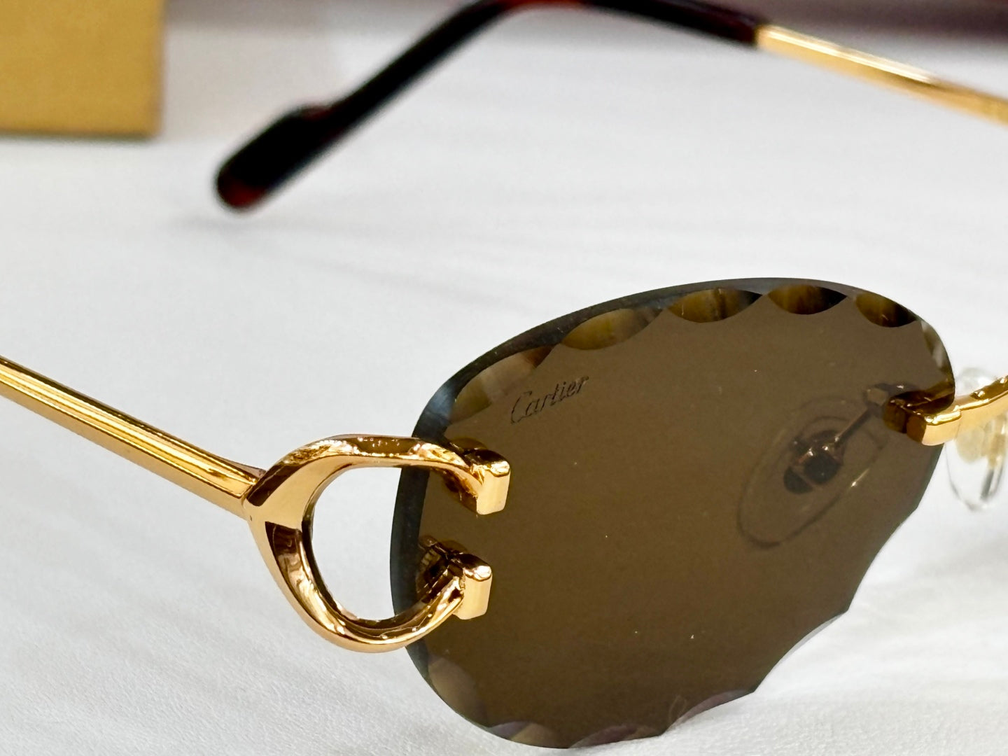 C DE RIMLESS ROUND FRAME SUNGLASSES CT0599S IN METAL