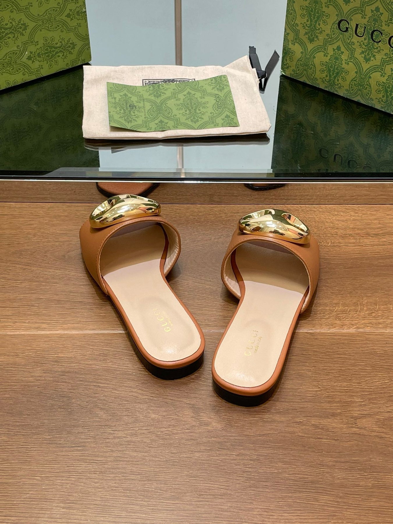 FLAT MULE IN BRONE BROWN CALFSKIN WITH GOLD HARDWARE