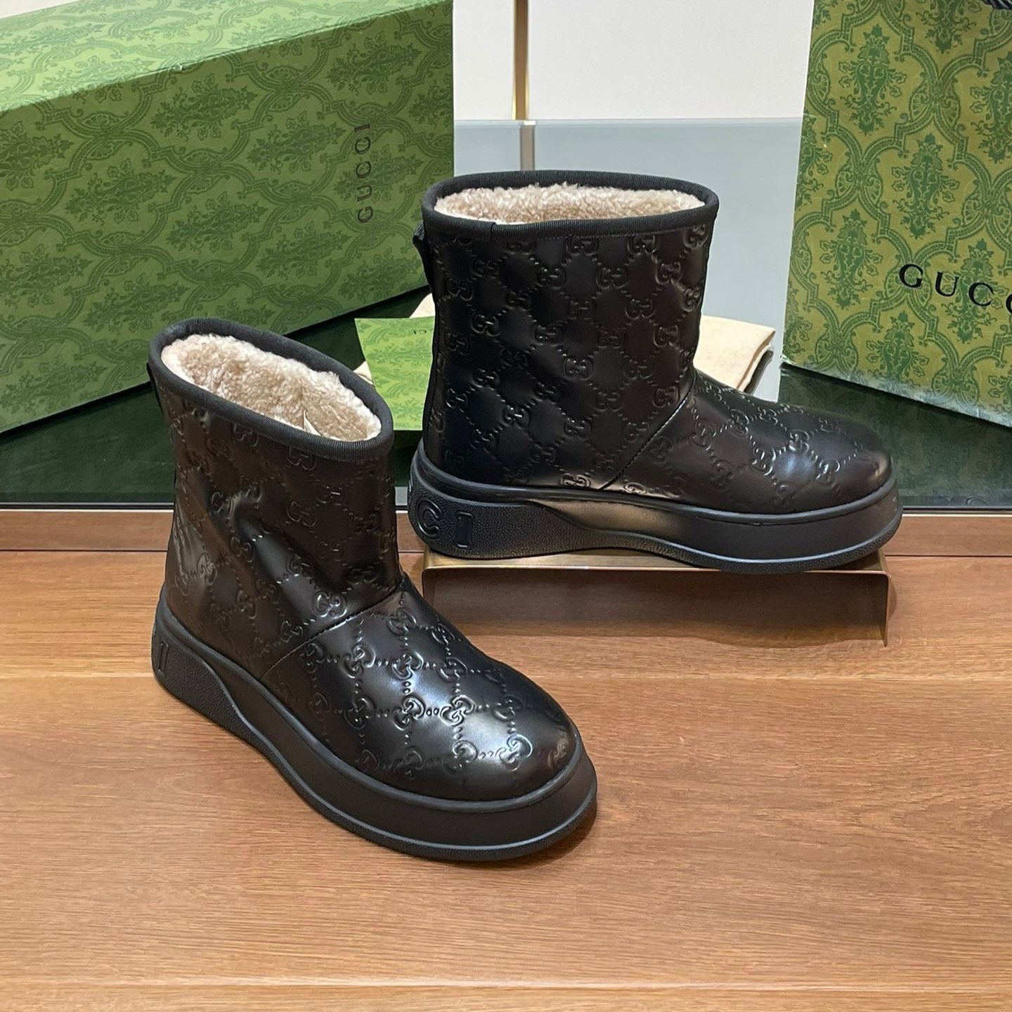 GG UGG BOOTS IN BLACK EMBOSSED DEERSKIN AND BEIGE WOOL LINING