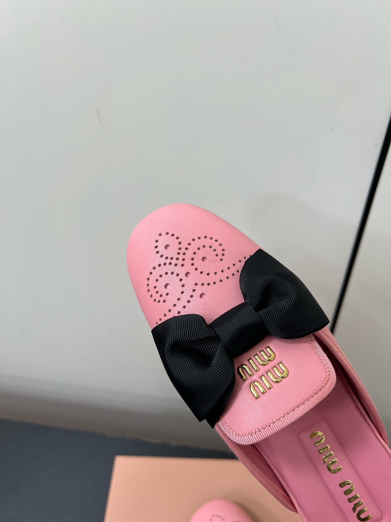 BOW MULES IN PINK SHEEPSKIN