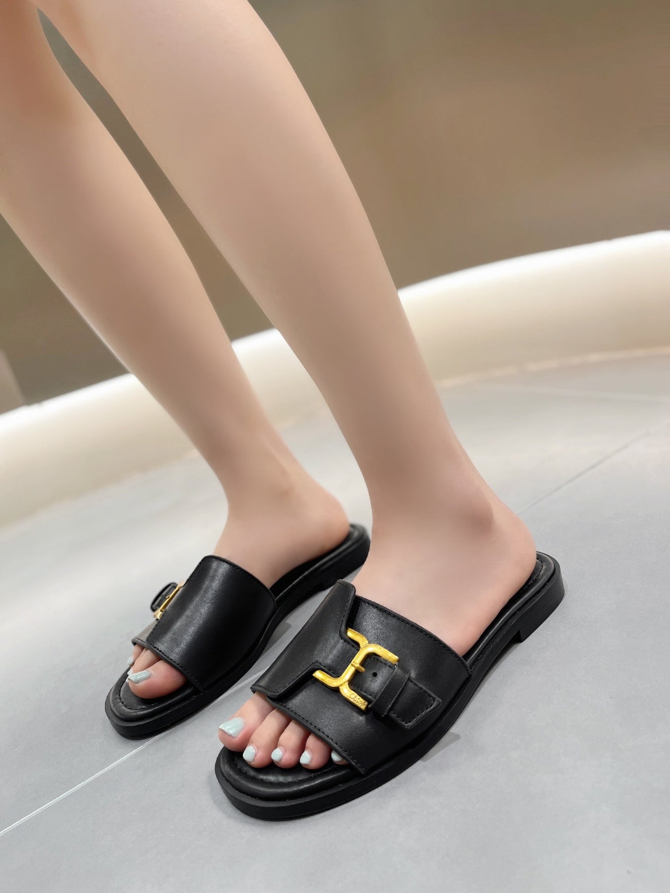 MARCIE SLIDE IN BLACK CALFSKIN WITH GOLD HARDWARE