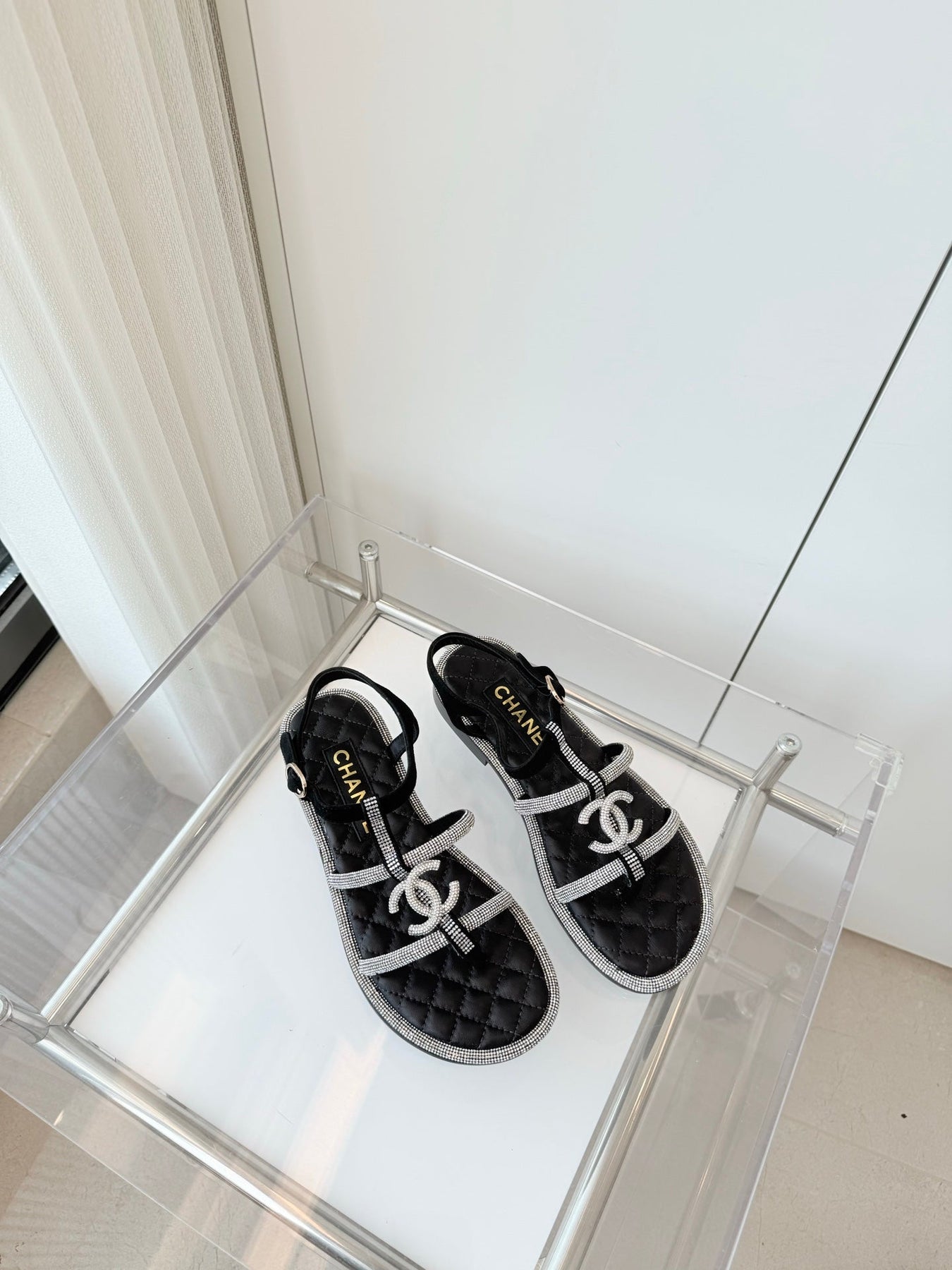 FLAT SANDALS IN BLACK SOFT LEATHER WITH SILVER STONE