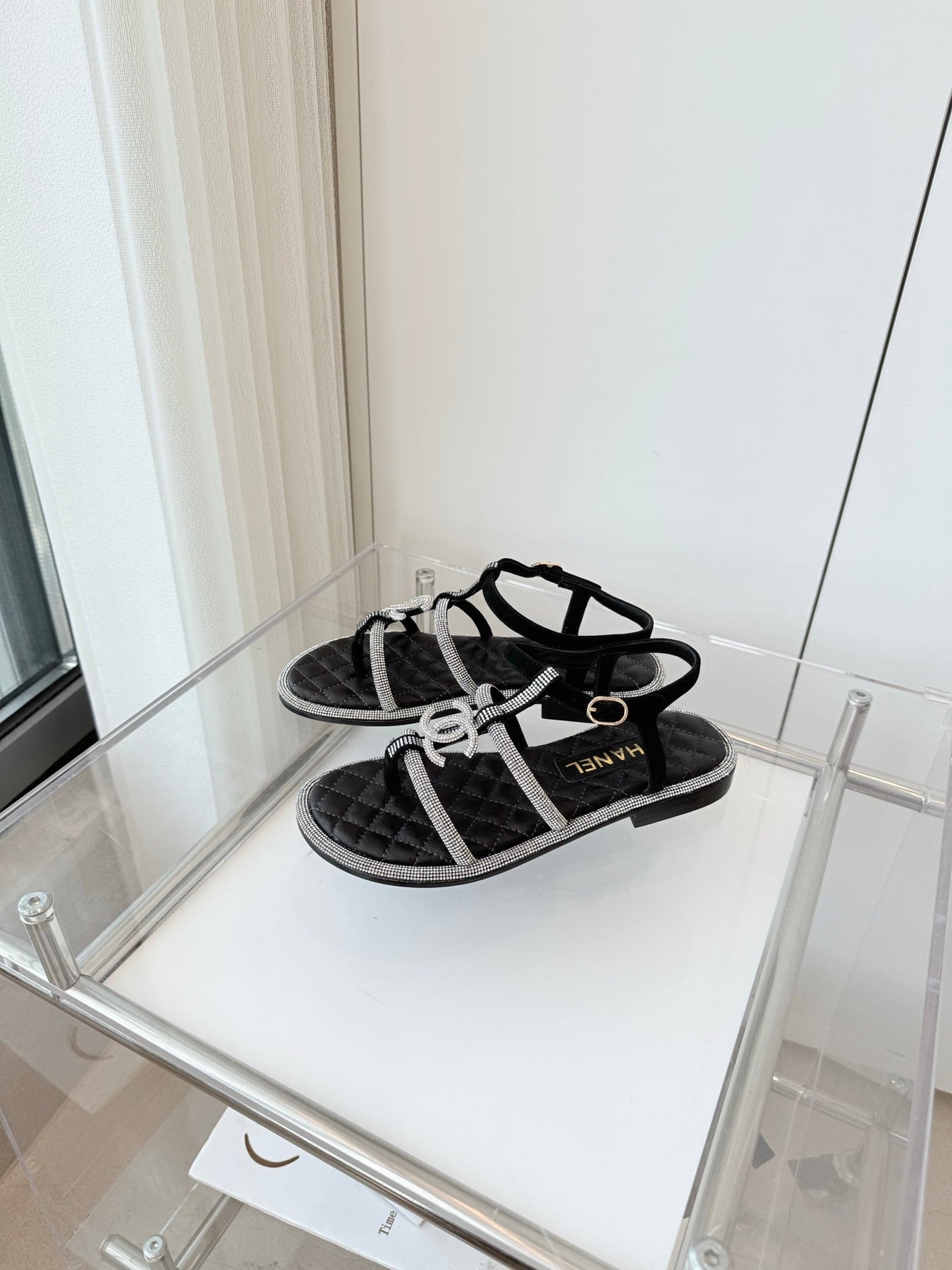 FLAT SANDALS IN BLACK SOFT LEATHER WITH SILVER STONE
